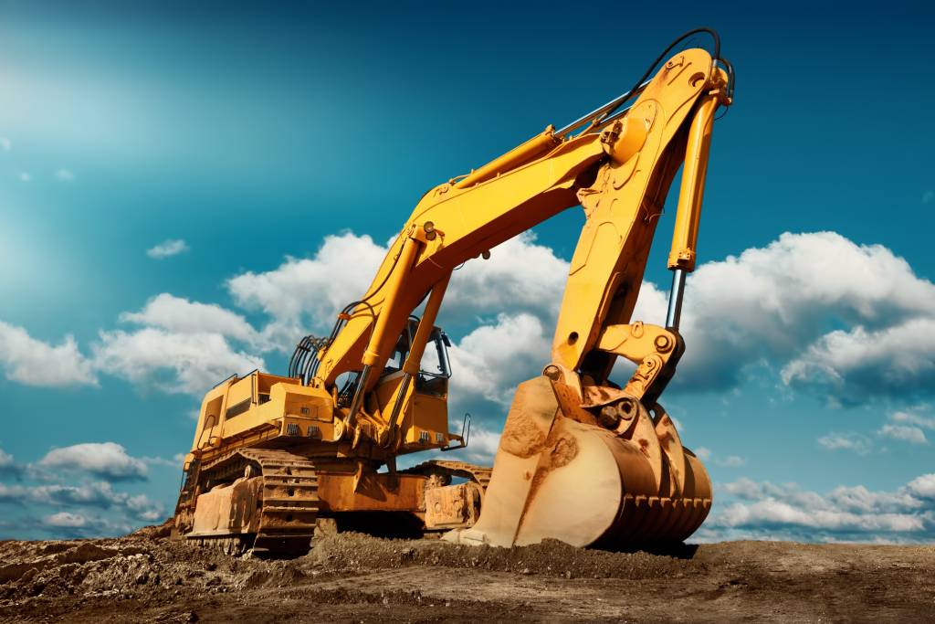 Compact excavator sitting on a job site