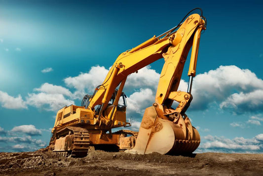 Compact excavator sitting on a job site